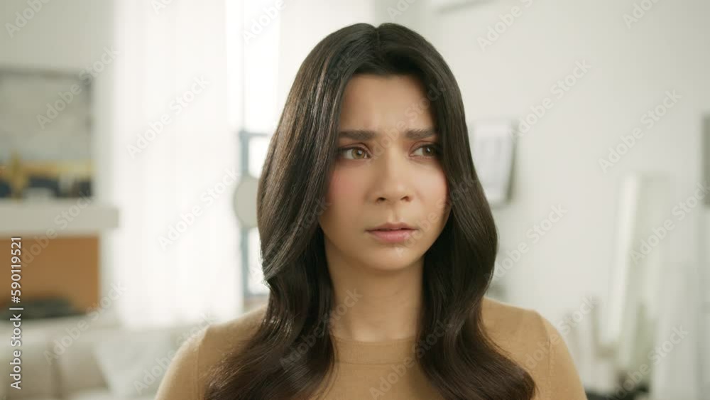 Upset female face of sad stressed hispanic girl with broken heart. Crying woman looking at camera with resentful offended facial expression worry about life problem. Series of face emotions close up Upset female face of sad stressed hispanic girl with broken heart. Crying woman looking at camera with resentful offended facial expression worry about life problem. Series of face emotions close up