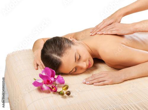 Beautiful young woman relaxing with hand massage at beauty spa