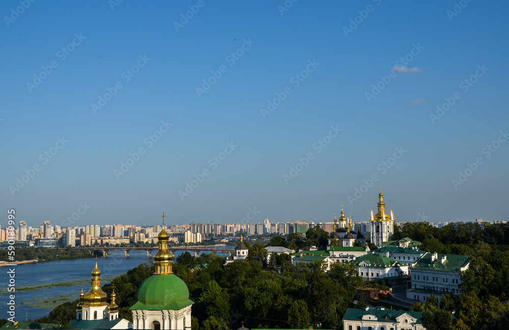 Fototapeta premium The domes of the Kyiv Pechersk Lavra overlook the Dnipro River and the left-bank part of Kyiv, capital of Ukraine