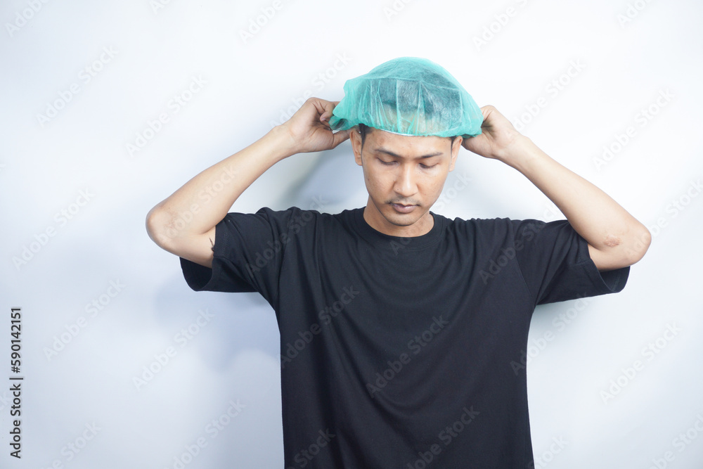 Asian youth wearing hairnet. isolated on white Asian youth wearing hairnet. isolated on white