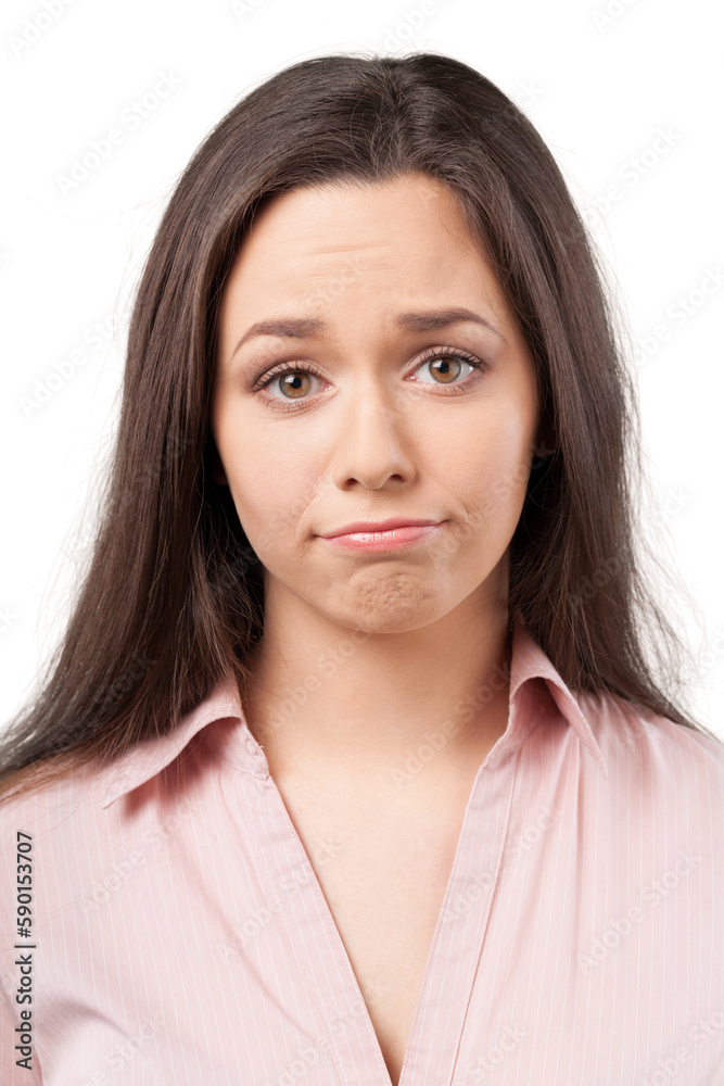 Close up portrait of a beautiful upset girl looking at camera on a white background Close up portrait of a beautiful upset girl looking at camera on a white background