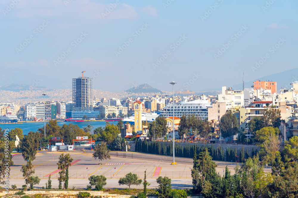View of Athens, the Parthenon Temple and the Propylaea Gate on Acropolis Hill, with Mount Lycabettus slightly further away, from the Piraeus Greece cruise port.