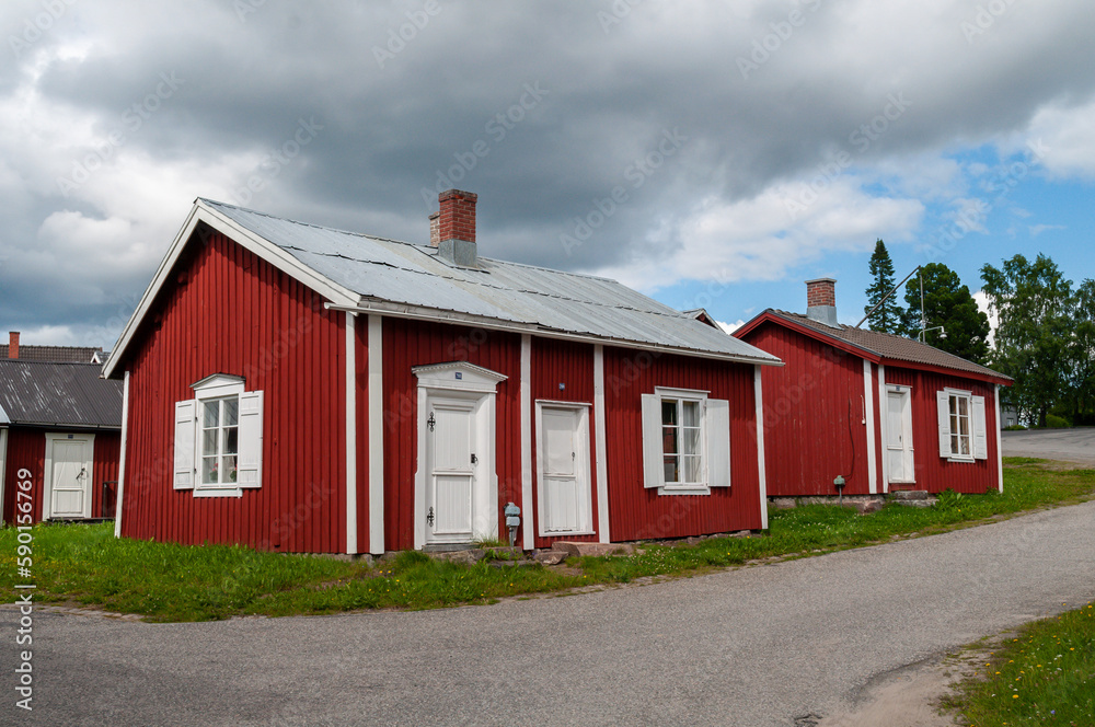 Gammelstad, Lulea, Sweden - street with small red historic wooden houses. A protected heritage village in the north of Europe.