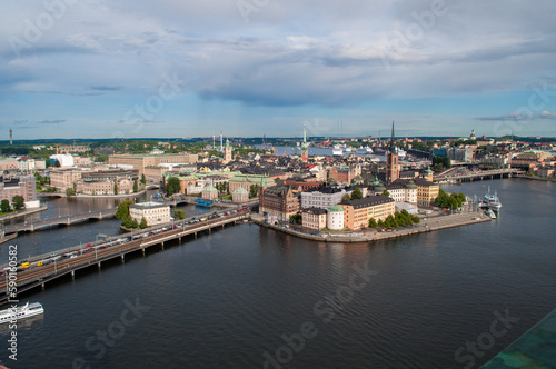 Stockholm, Sweden - July 20, 2015: City skyline with water canals, old buildings and embankment with bridges