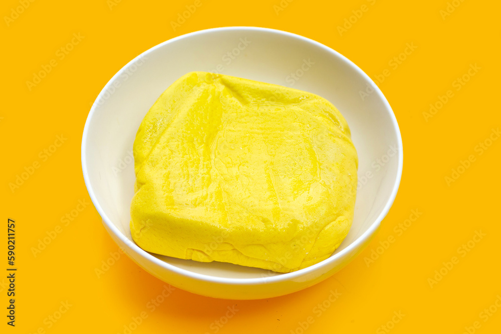Yellow tofu on yellow background.