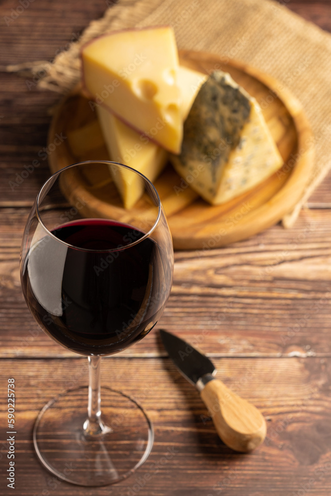 Cheese board with a glass of red wine. Cheese board with a glass of red wine.
