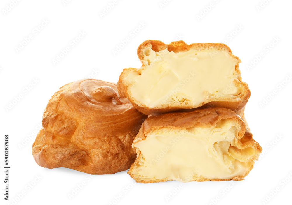 Cut and whole delicious profiteroles with cream filling on white background Cut and whole delicious profiteroles with cream filling on white background