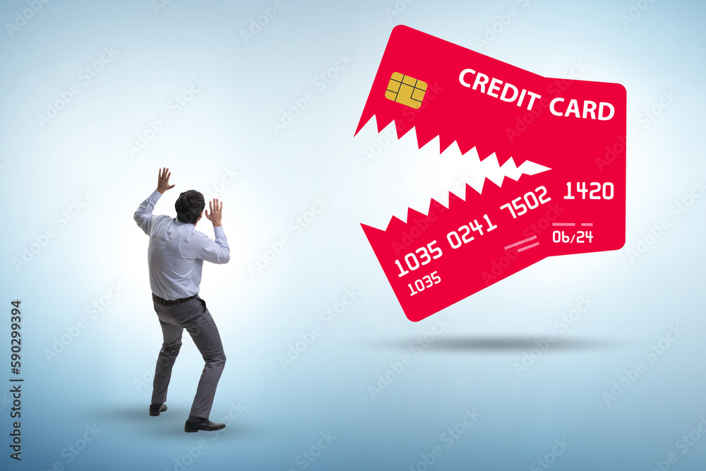 Businessman in credit card debt concept Businessman in credit card debt concept