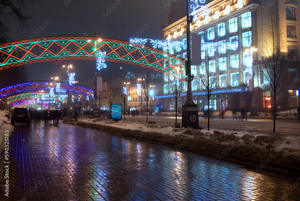 Kreschatik Street in central Kyive at night with snow and Christmas and new years lights