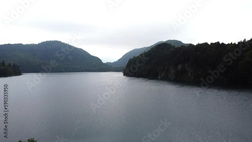 Aerial reveal view of Lake Lucerne Neuschwanstein Castle and the Swiss Alps