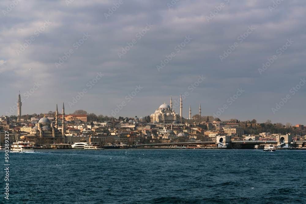 View of the Fatih district of Istanbul from the water of the Golden Horn Bay, Suleymaniye Mosque, New Mosque on a sunny day, Istanbul, Turkey