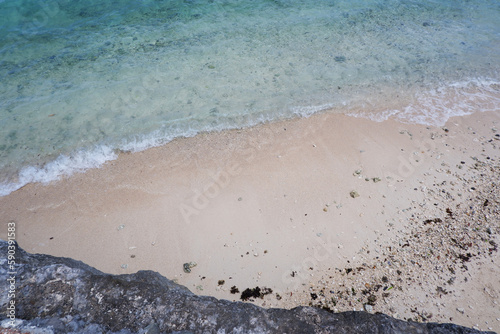 Blue ocean wave. White sand beach with blue water and wave. Tropical sea background. photo