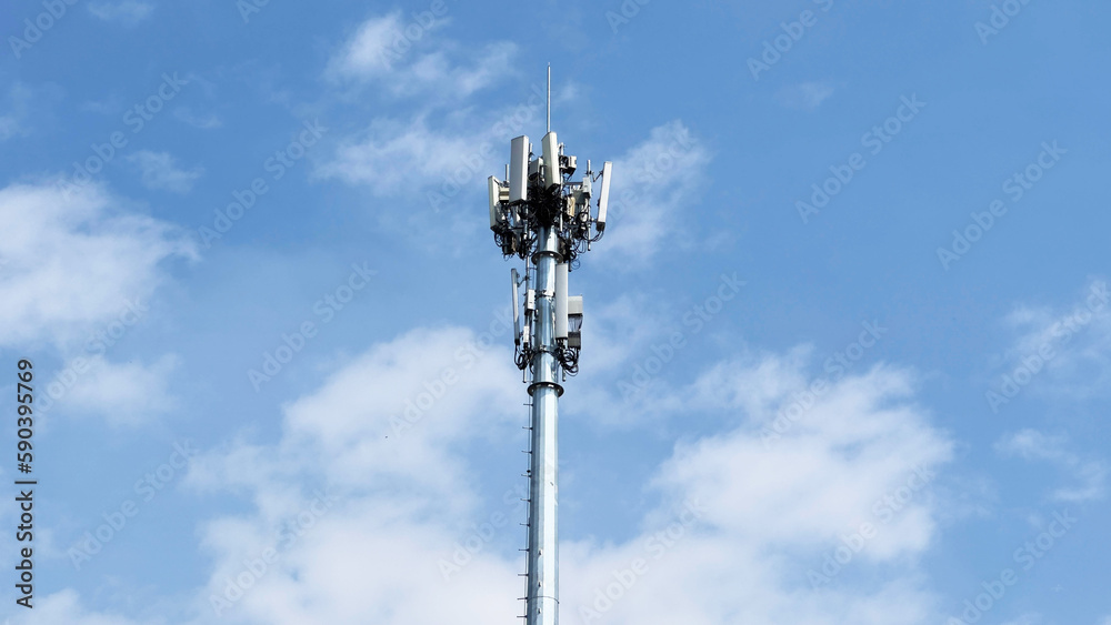 signal tower and blue sky with white clouds