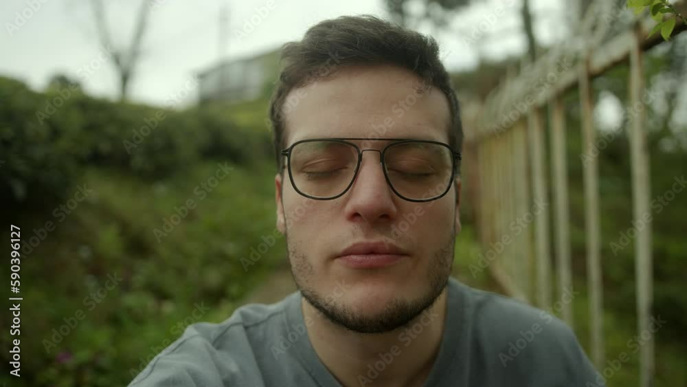 A Young Handsome Brown-Haired Man Engaged in a Video Conference, Looking Directly at the Camera and Listening Attentively - POV Shot A Young Handsome Brown-Haired Man Engaged in a Video Conference, Looking Directly at the Camera and Listening Attentively - POV Shot