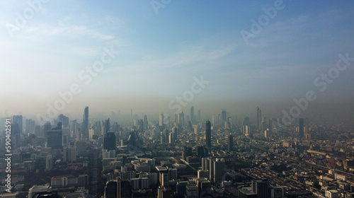 Aerial view of dense thick layer of air pollution and dust covering the city of Bangkok, Thailand, during morning time.