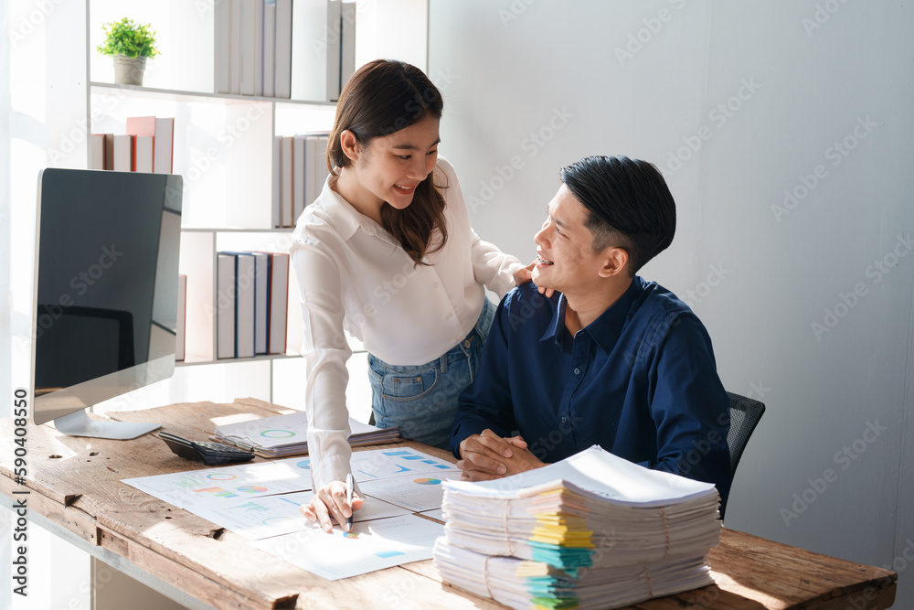 Startup family business, husband and wife discussing financial affairs, investing, making profit, tax deduction from trading using computer and investment budget paperwork working Startup family business, husband and wife discussing financial affairs, investing, making profit, tax deduction from trading using computer and investment budget paperwork working
