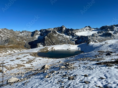 Nameless high alpine lakes in the Abula Alps mountain massif and above the Swiss road pass Fluela (Flüelapass), Zernez - Canton of Grisons, Switzerland (Kanton Graubünden, Schweiz) photo