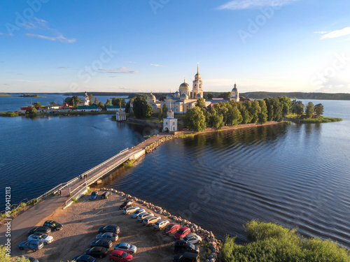 View of the ancient Nilo-Stolobensky monastery on Seliger lake Seliger on a sunny July evening (aerial view). Svetlitsa. Tver region, Russia photo