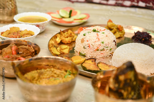 Bengali food thali in kolkata. bengali thali for puja and Pailaboishakh. Bengali Thali with Vegetables , Chicken , Prawn, Ilish and Sweets. design for banner. Restaurant food.