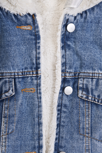 Stylish blue denim jacket with white fur lining.