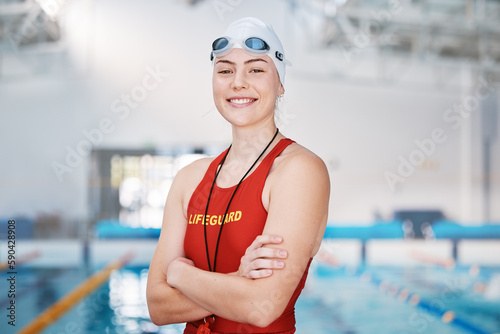 Swimming pool, lifeguard and portrait of woman with confidence and goggles at water for safety training exercise. Professional sports, life saving workout and swimmer at swim competition with pride. photo