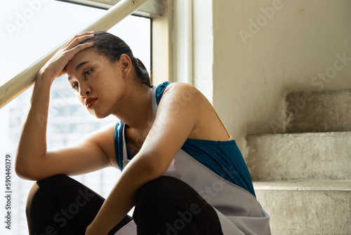 Принти на полотні Unhappy and depressed Asian cleaning service worker woman, concept image of low