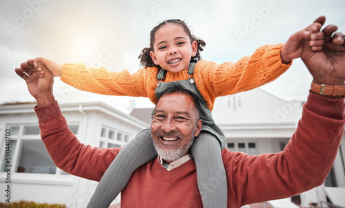 Shoulder hug and portrait of grandfather and girl for bonding, playful and affectionate. Weekend, free time and happiness with family on lawn at home for support, care and holiday together #590440700