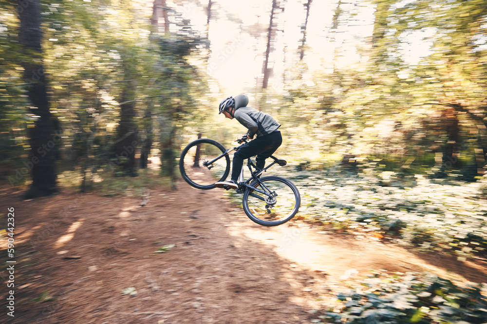 Cycling, speed and man on a bicycle on a forest road doing training and exercise on a bike. Fast, outdoor trail and athlete on a drive with energy on a nature adventure with fitness on a path Cycling, speed and man on a bicycle on a forest road doing training and exercise on a bike. Fast, outdoor trail and athlete on a drive with energy on a nature adventure with fitness on a path