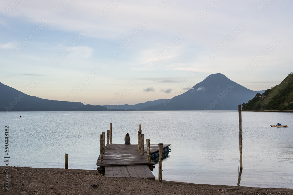 Breathtaking Landscape of Lake Atitlán in the Guatemalan Highlands. This stunning lake, nestled in the Sierra Madre mountain range, is a massive volcanic crater in Guatemala's southwestern highlands