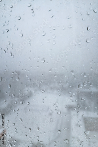 Wet window with rain drops