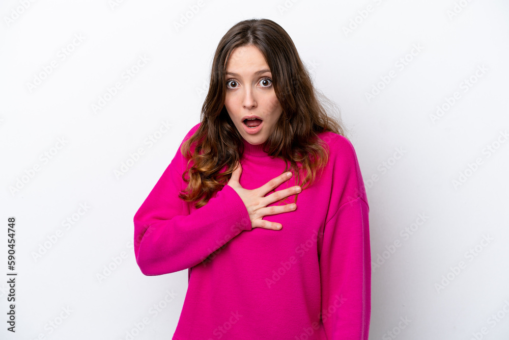 Young caucasian woman isolated on white background surprised and shocked while looking right Young caucasian woman isolated on white background surprised and shocked while looking right