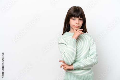 Little caucasian girl isolated on white background and thinking © luismolinero