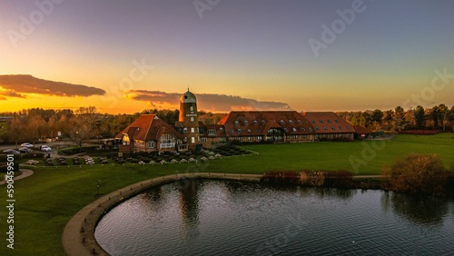 Aerial view of Caldecotte lake and its surroundings at sunset photo