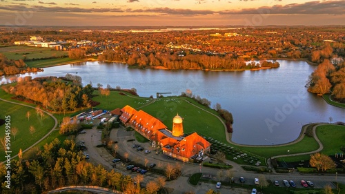 Aerial view of Caldecotte lake and its surroundings on a beautiful autumn evening