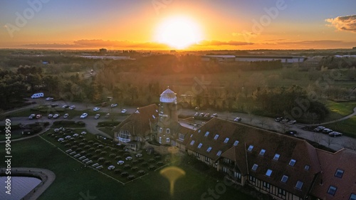 Aerial view of The Caldecotte - Pub & Grill building at sunset photo