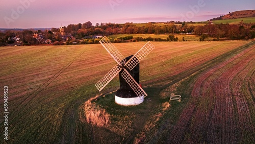 Aerial view of Pitstone Windmill and agricultural fields at sunset photo