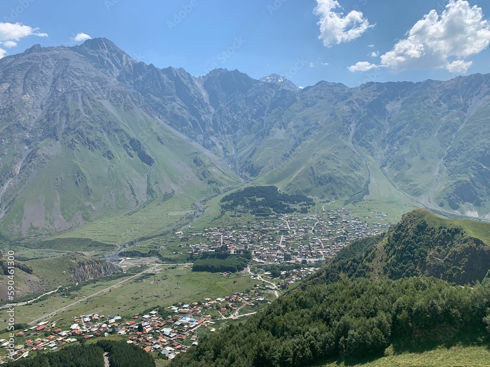 High angle shot of green mountains in Kazbegi surrounded by green mountains in Georgia