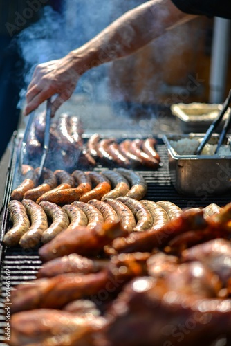 Photography a woman is making hot dogs for sale at a festival