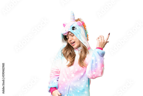 Young girl with unicorn pajamas over isolated chroma key background making guitar gesture