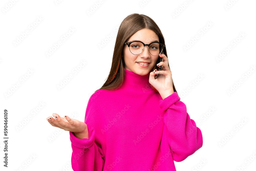 Teenager girl over isolated chroma key background keeping a conversation with the mobile phone with someone Teenager girl over isolated chroma key background keeping a conversation with the mobile phone with someone
