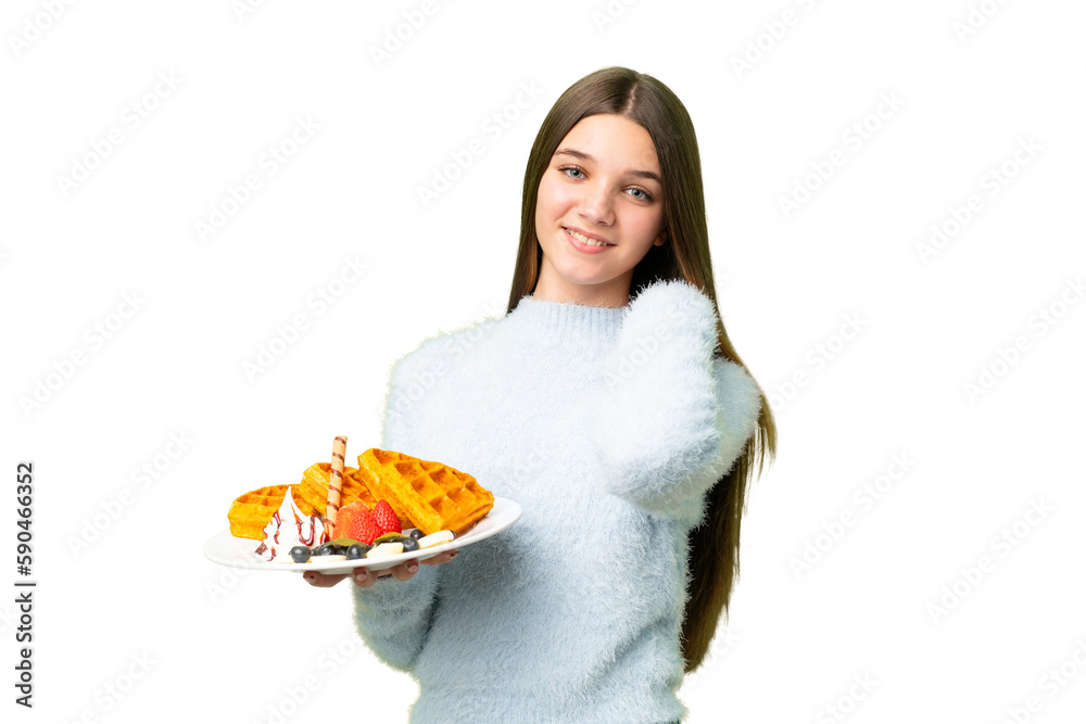 Teenager girl holding waffles over isolated chroma key background laughing Teenager girl holding waffles over isolated chroma key background laughing