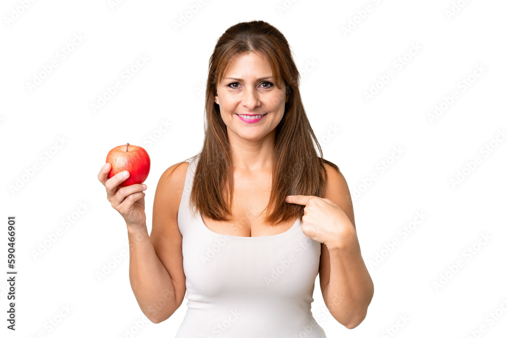 Middle age woman with an apple over isolated background with surprise facial expression Middle age woman with an apple over isolated background with surprise facial expression