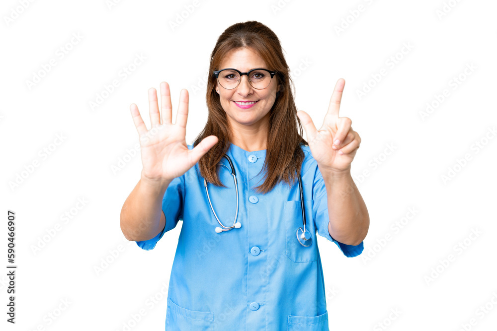 Middle age nurse woman over isolated background counting seven with fingers Middle age nurse woman over isolated background counting seven with fingers