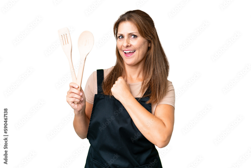 Middle age caucasian woman holding a rolling pin over isolated background celebrating a victory Middle age caucasian woman holding a rolling pin over isolated background celebrating a victory