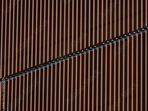 architecture of brown aluminum line wall