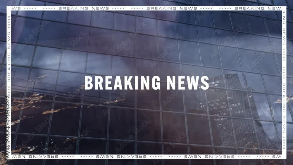 Person typing on a keyboard projected on a glass business building with the BREAKING NEWS writing Person typing on a keyboard projected on a glass business building with the BREAKING NEWS writing