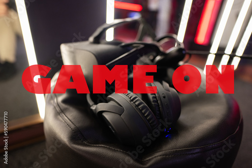 Game on concept. Professional headphones with microphone and vr glasses for video games and cyber sports on background.