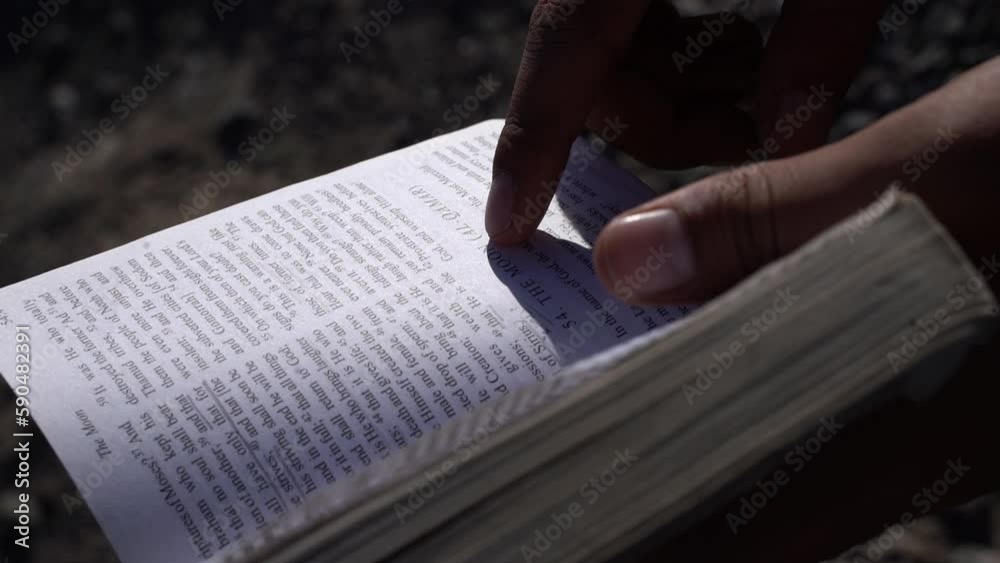 Reading Quran with finger. Reading a Holy Book in English. Surah The moon, Al-Qamar. Slowmotion Footage. Reading Quran with finger. Reading a Holy Book in English. Surah The moon, Al-Qamar. Slowmotion Footage.