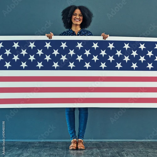 Obraz Portrait, American flag and woman with smile, patriotic and pride for country against a wall. Face, female and person with USA symbol, confidence and motivation for freedom, human rights or happiness