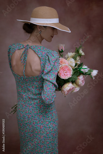 Romantic woman in hat with bouquet of flowers.Art processing.